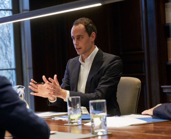 Patrick Kavanagh, Director, Actuarial Services in an advisory service meeting in boardroom