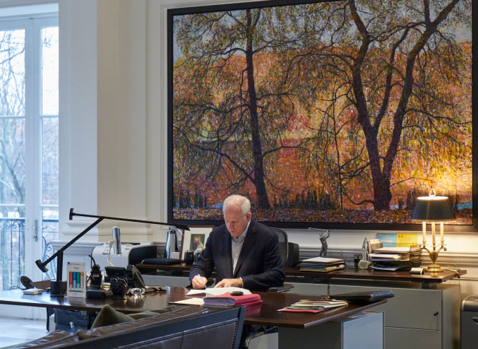 Joe Pal sitting at his desk in his office