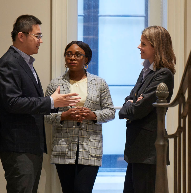Kate Pal and team having a conversation in Pal Insurance office